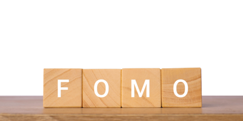 Wooden blocks with word fomo for marketing fear of missing out concept, isolated on transparent background