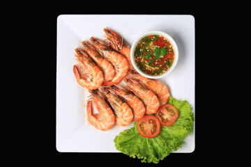Fresh sea shrimp grilled over charcoal until cooked, served with Thai seafood sauce, Food photography for use in menus
