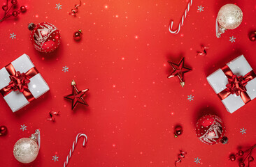 Merry Christmas and Happy New Year greeting card. Christmas gifts with red glitter decorations on...
