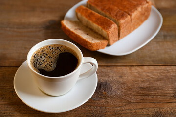 Obraz premium cup of coffee and bread for breakfast