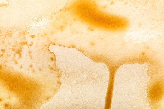 Paper with coffee stains as background