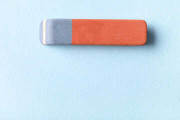 School eraser on blue background