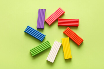 Colorful plasticine on green background