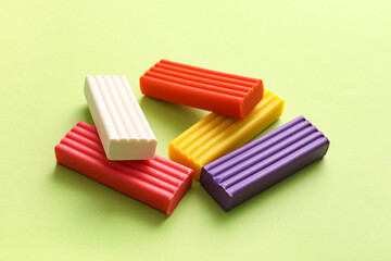 Colorful plasticine on green background