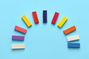 Colorful plasticine on blue background