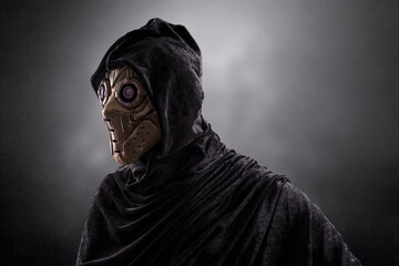 Robot android over dark misty background with clipping path