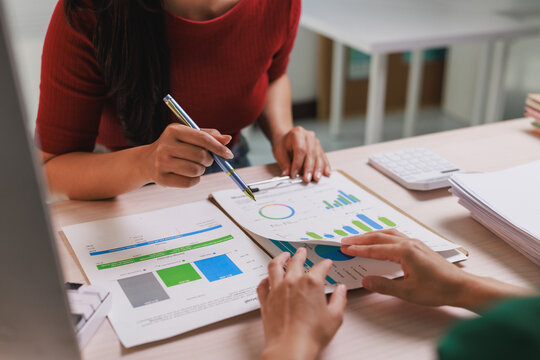 Business colleagues discussing financial project data graphs