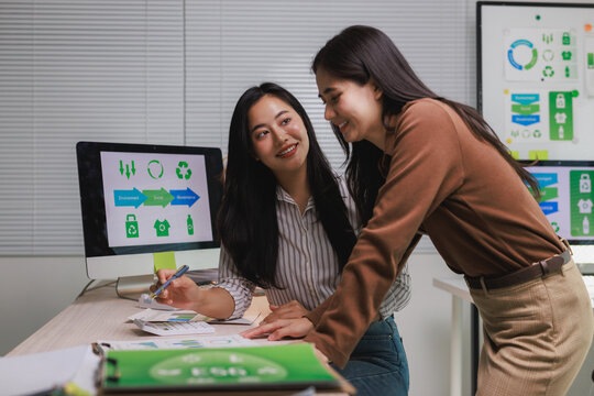 Businesswomen collaborating on sustainable esg strategy development