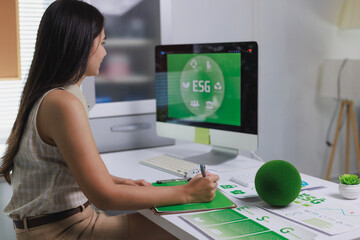 Woman analyzing esg data planning green sustainable business strategy