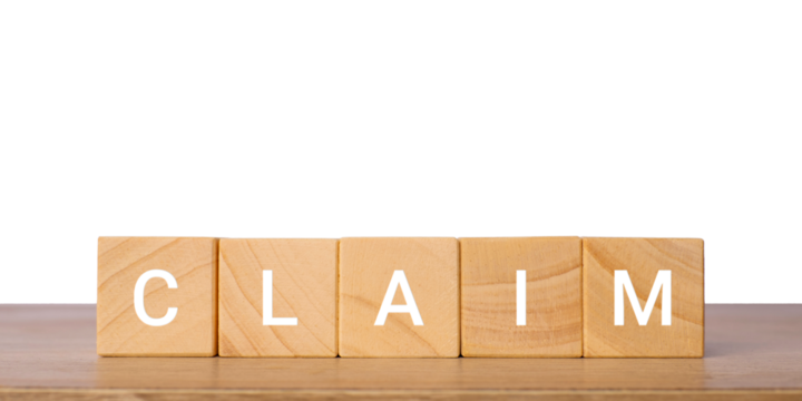 Wooden blocks with word claim for insurance and legal concept, isolated on transparent background