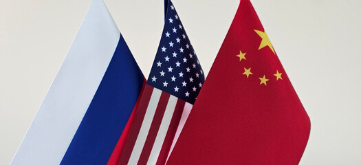 Russian, American, and Chinese Flags Displayed on Stands