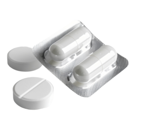 Two white capsules in blister packaging along with two loose tablets on a transparent background