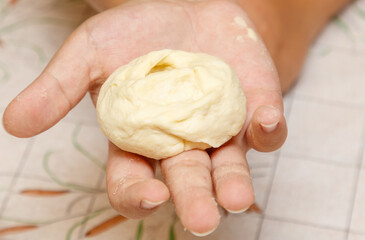 A hand holding a doughnut
