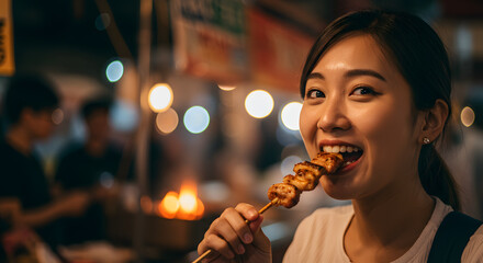 Smiling Asian woman enjoying delicious grilled street food skewer at a vibrant night market