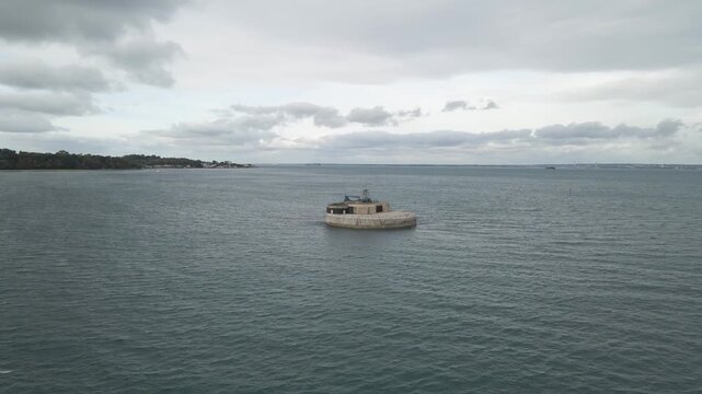 Aerial view St Helens Fort, sea fort in the Solent close to the Isle of Wight, was built as result of the Royal Commission on the Defence of the United Kingdom of 1859, Drone rotating to the right.