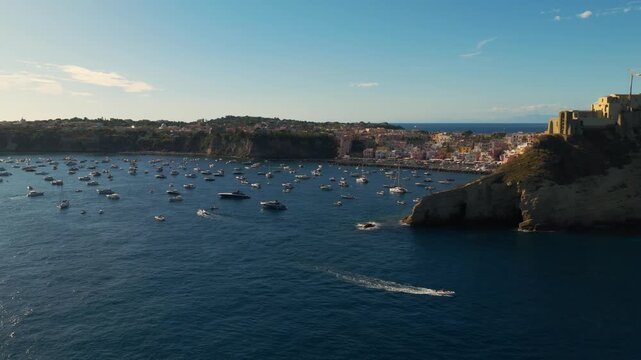 Colorful Fishing Village Of Marina Corricella On The Island Of Procida, Italy At Sunset. Aerial Rotating Shot