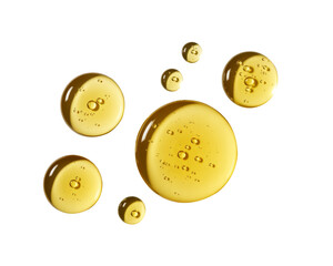 Fototapeta premium Golden Liquid Drops on White Background