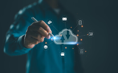 Businessman using stylus to interact with cloud computing interface for data upload and download. Concept for cloud technology, data storage, remote access, digital transformation, and networking.