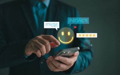 Customer giving positive feedback using smartphone with smiley face, star rating, and chat bubbles. Concept for user experience, customer satisfaction, online review, and digital feedback system.