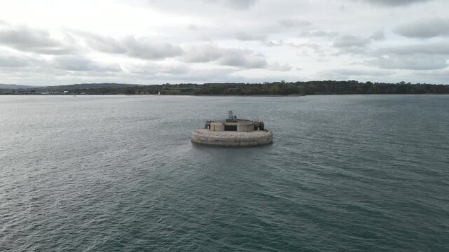 Aerial view St Helens Fort, sea fort in the Solent close to the Isle of Wight, was built as result of the Royal Commission on the Defence of the United Kingdom of 1859, drone slowly moving forward.