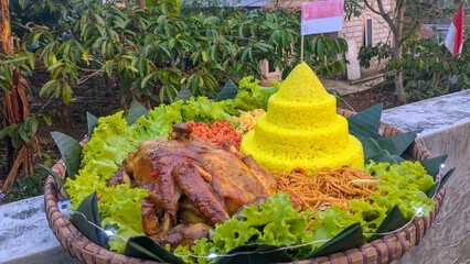 Indonesian Nasi Tumpeng Cone Rice Ceremony, Independence Day August 17th Celebration with Whole Roasted Chicken