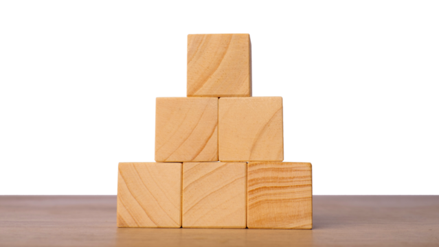 Wooden cubes stacked in pyramid for structure and foundation concept, isolated on transparent background
