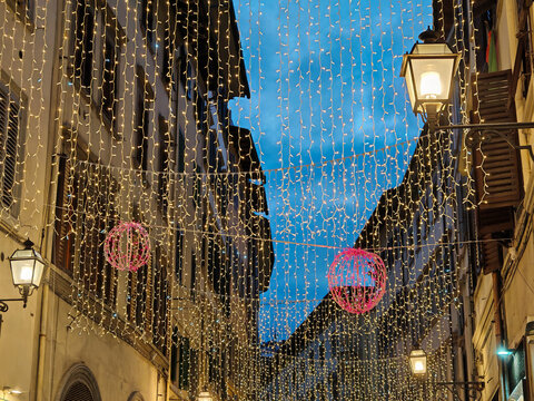 Sparkling Christmas lights along the main street of Florence in Tuscany