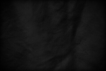 Black fabric sheets background or texture.