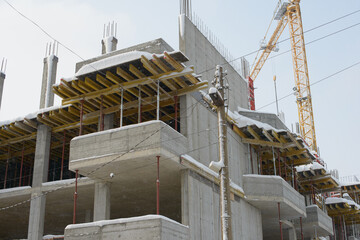 Concrete Structure Rising Through Light Falling Winter Snow