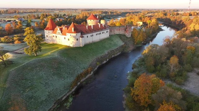 The Memele River flows past Bauska Castle in Latvia