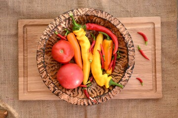 High-contrast rustic composition featuring vibrant vegetables ready for cooking. The arrangement suggests the start of a recipe, perfect for themes of Mexican cuisine, home cooking.