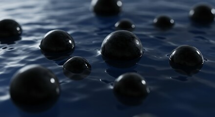 Abstract dark spheres floating on a blue liquid surface.