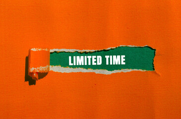 Limited Time message written on ripped torn paper background. Conceptual Limited Time symbol. Copy...