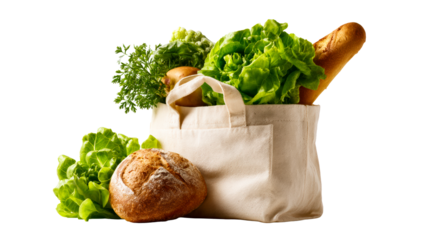Fresh organic produce including lettuce, carrots, potatoes, and a baguette in a canvas grocery bag for healthy food shopping and sustainable living.