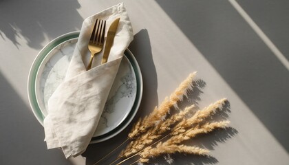 Elegant Dining Setup: A meticulously arranged dining scene, featuring a delicate ceramic plate adorned with a cloth napkin, knife and fork, paired with the rustic charm of wheat.