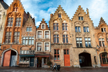Traditional building architecture along a plaza in Brugge in Flanders, Belgium