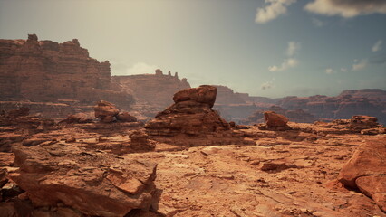 A breathtaking desert scene unfolds with unique rock formations and vast terrain. The sunlight casts dramatic shadows, enhancing the rugged beauty of this arid landscape.