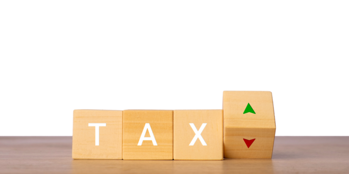 Wooden blocks with tax word and up down arrows for tax rate change concept, isolated on transparent background