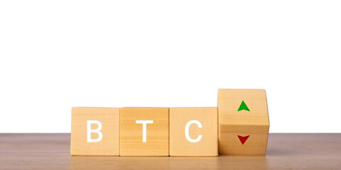 Fototapeta premium Wooden blocks with BTC letters and up down arrows for bitcoin price concept, isolated on transparent background