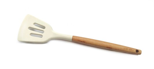 White Silicone Slotted Spatula with Wooden Handle. Cooking Preparation. Isolated on White Background