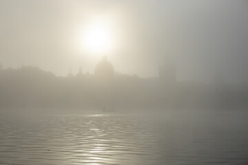 Charles bridge architecture shrouded in dense fog