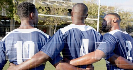 Standing together, three players with arms linked on stadium grass, wearing navy jerseys 10 4 2