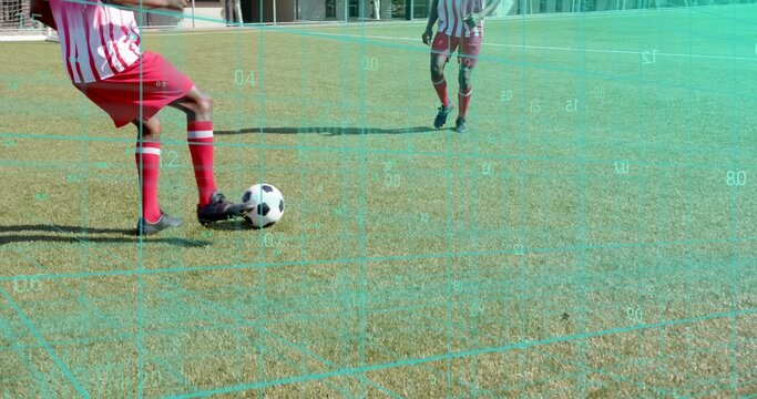 Controlling player in red-striped kit moving on soccer field with ball and grid overlay, copy space