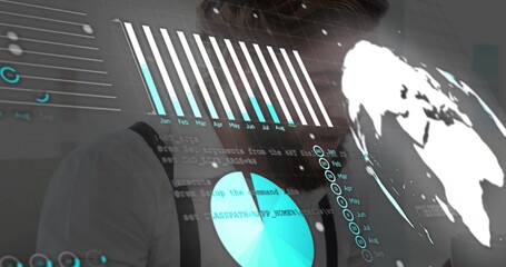 Analyzing man wearing white shirt and suspenders studying digital charts and globe in control room