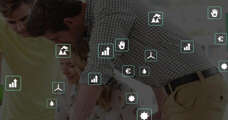 Leaning team of four in checked shirt, blouse reviewing data at meeting table, with laptop overlay