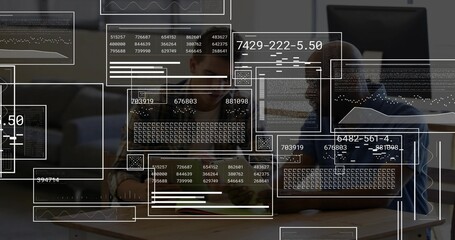 Collaborating two colleagues in striped and short-sleeve shirts reviewing code overlays on laptop