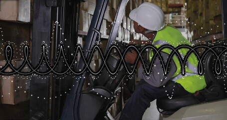 Driving forklift driver reaching controls in warehouse with helmet vest dotted overlay, copy space
