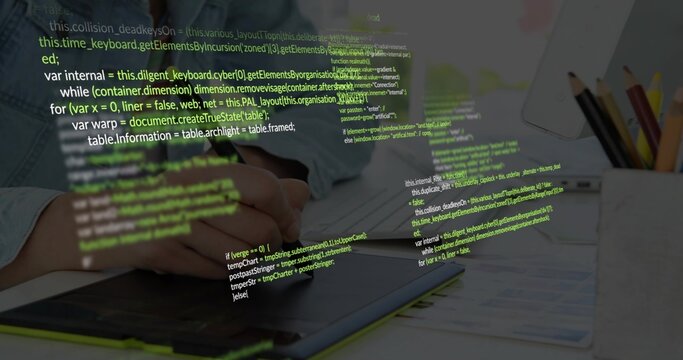 Working hands in denim shirt, using stylus editing on graphics tablet at desk, code overlay