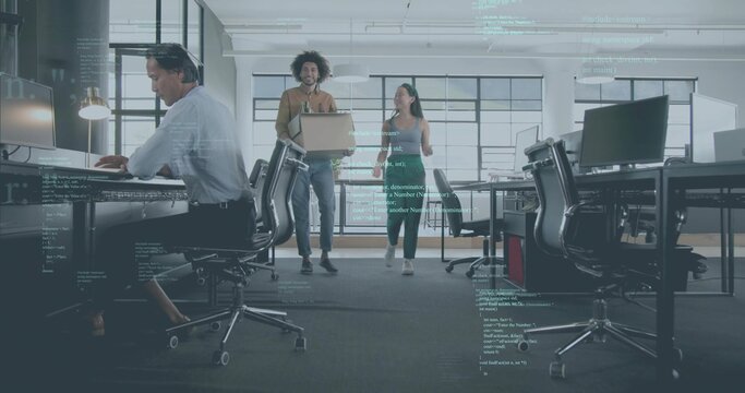 Walking colleagues in casual attire holding laptop, passing desks in office with code overlay - Powered by Adobe