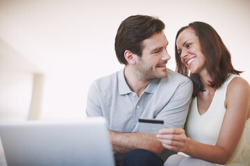 Credit card, love and couple with laptop in home with online payment for bills, account or mortgage. Happy, debit and people on computer for ecommerce shopping together in living room with space.